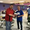 Donnie Philbeck receives check from MCBA President Harvey Poynter for the MCHS bowling team